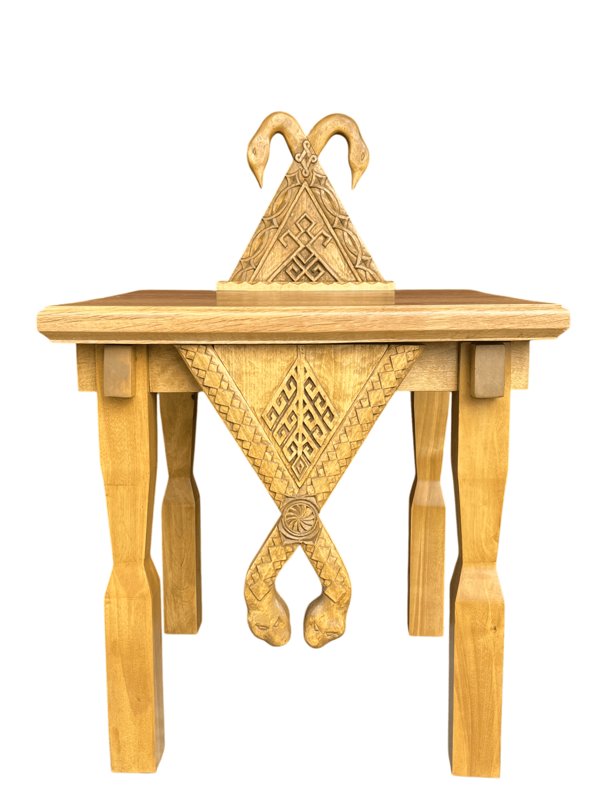 Hand-carved oak altar: a triangular structure with swans at the crest and serpents on the pendant.